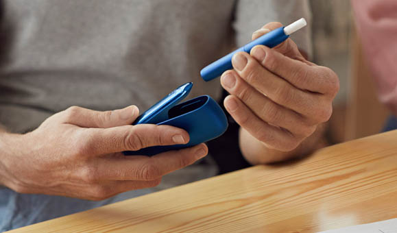 Man Holding IQOS 3 White