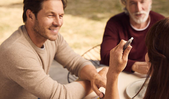 Man Holding IQOS 3 White