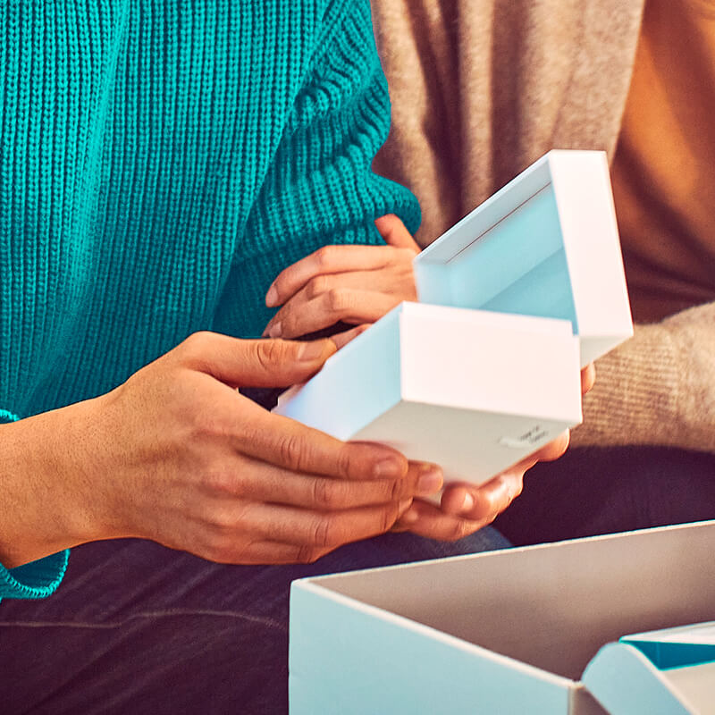 Man unboxing a new IQOS device.