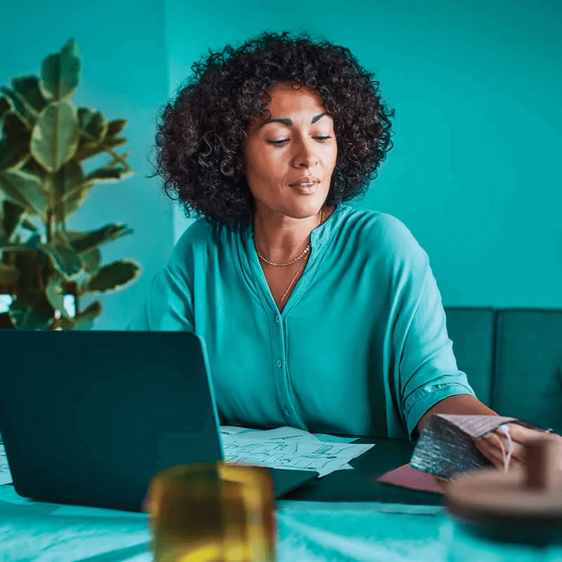 A woman looking at laptop