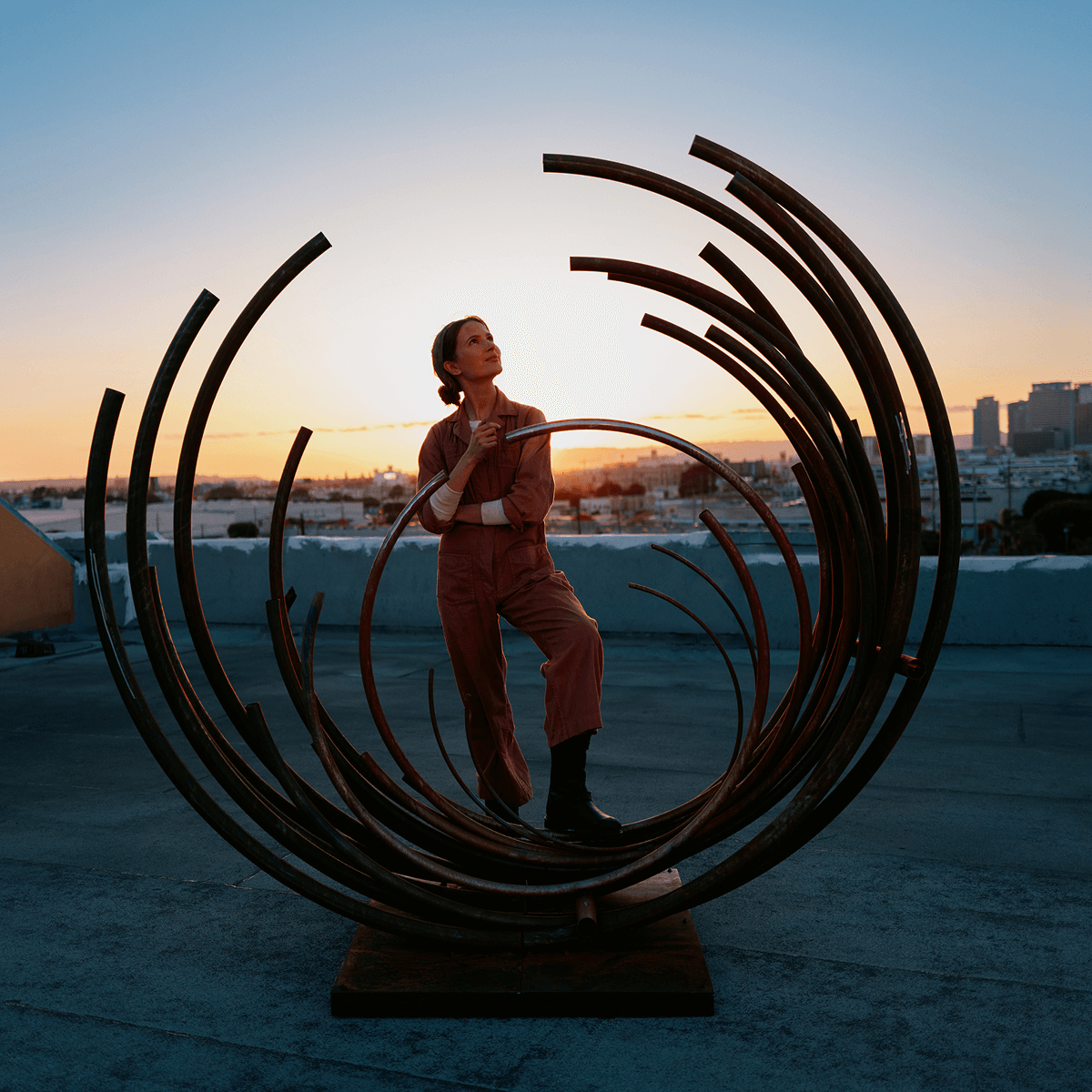 A woman admiring her artwork
