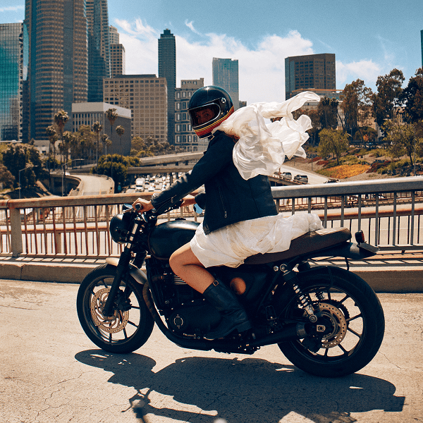 A bride riding a motorbike