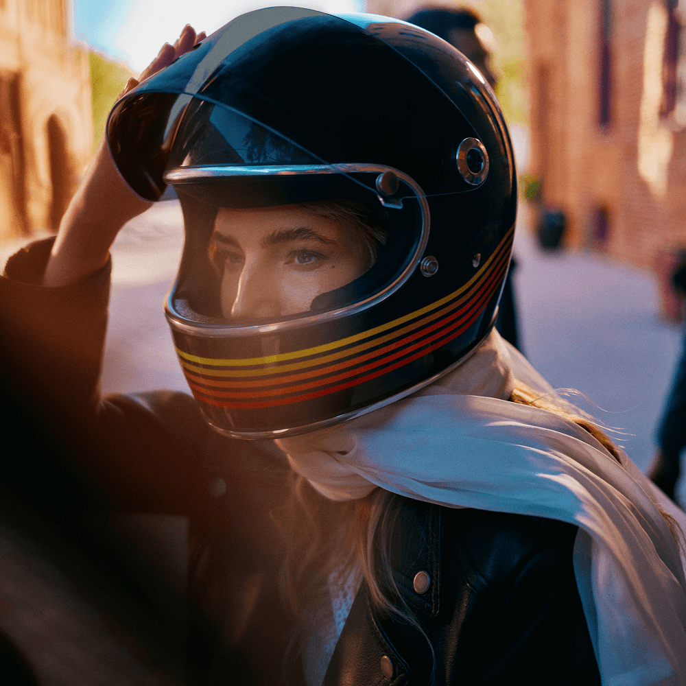 A woman wearing a motorbike helmet