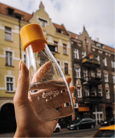 AI scent machine transferring small perfume bottle.