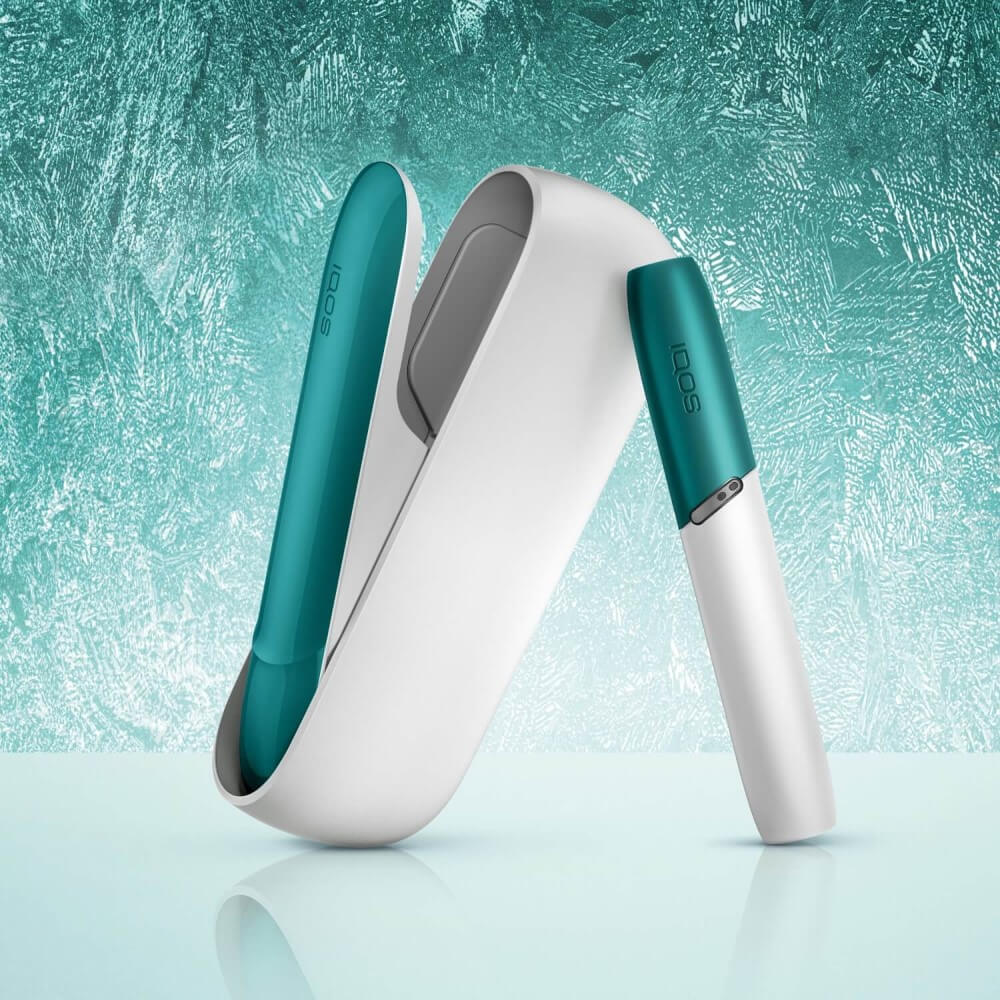 IQOS 3 DUO med grøn hætte og grønt cover.