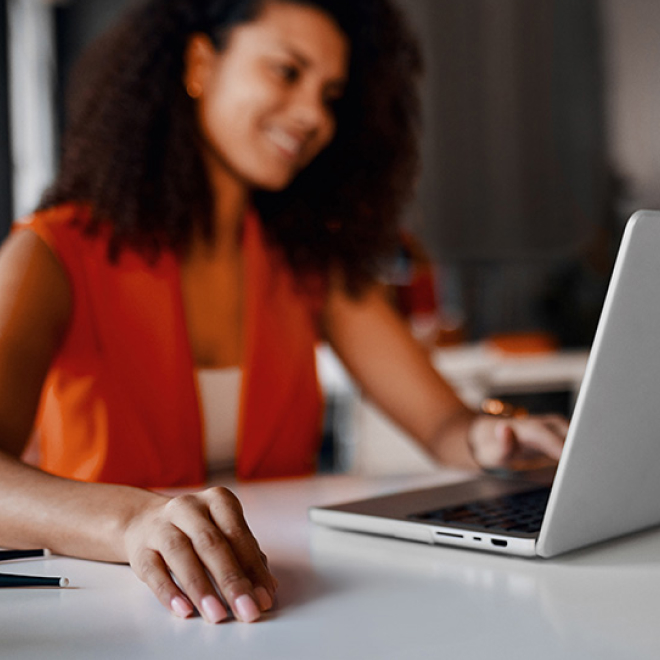 A woman looking at her computer